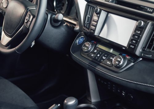 Luxury car Interior – steering wheel, shift lever, dashboard and computer