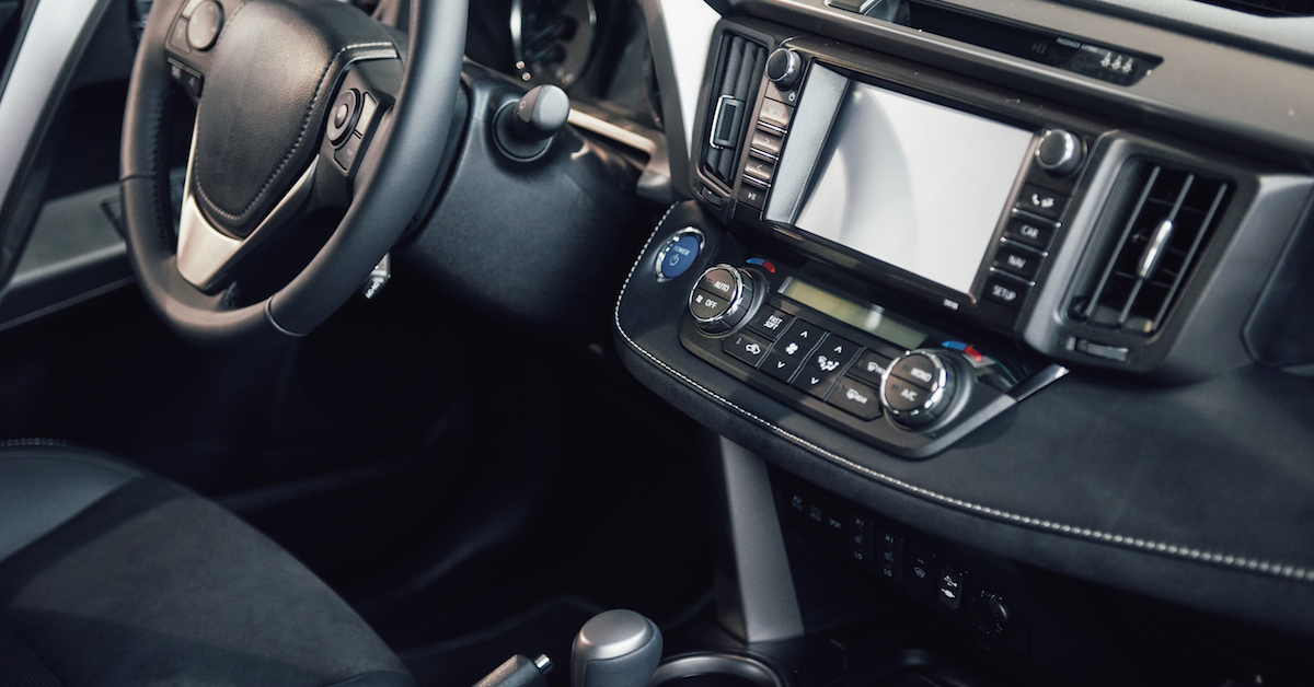 Luxury car Interior – steering wheel, shift lever, dashboard and computer