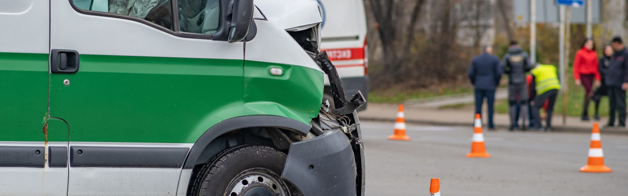 Heavily damaged car after car crash accident on a city street.
